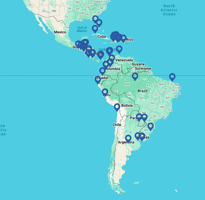 Um mapa da América Latina é mostrado com muitos marcadores azuis espalhados por vários países, destacando as principais zonas de livre comércio da LATAM no México, Guatemala, Cuba, Colômbia, Venezuela, Equador, Peru, Bolívia, Chile, Paraguai, Argentina, Uruguai, Brasil e Guiana.