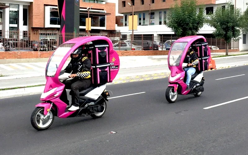 Motorcycle Delivery workers from PediSuper, a Guatemala tech company.